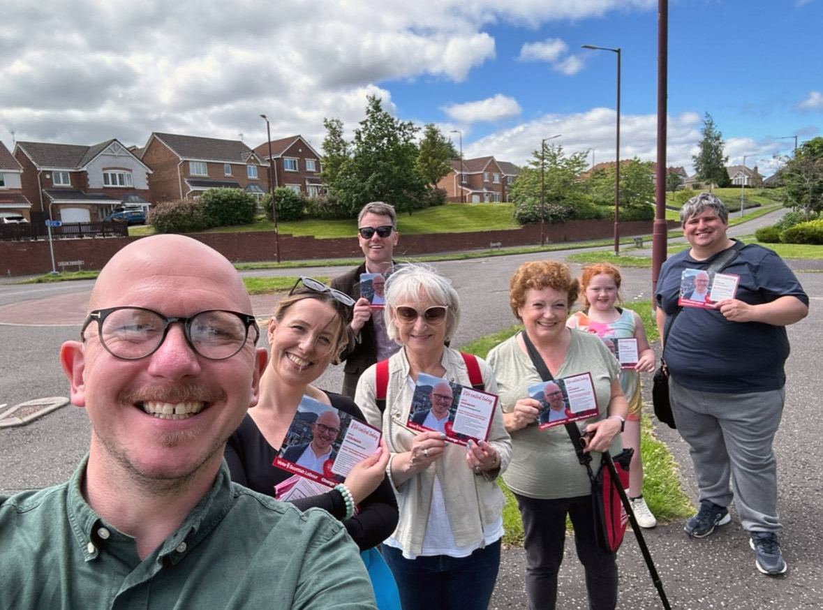 Falkirk Labour candidate for Alloa and Grangemouth, Brian Leishman with campaigners canvassing voters